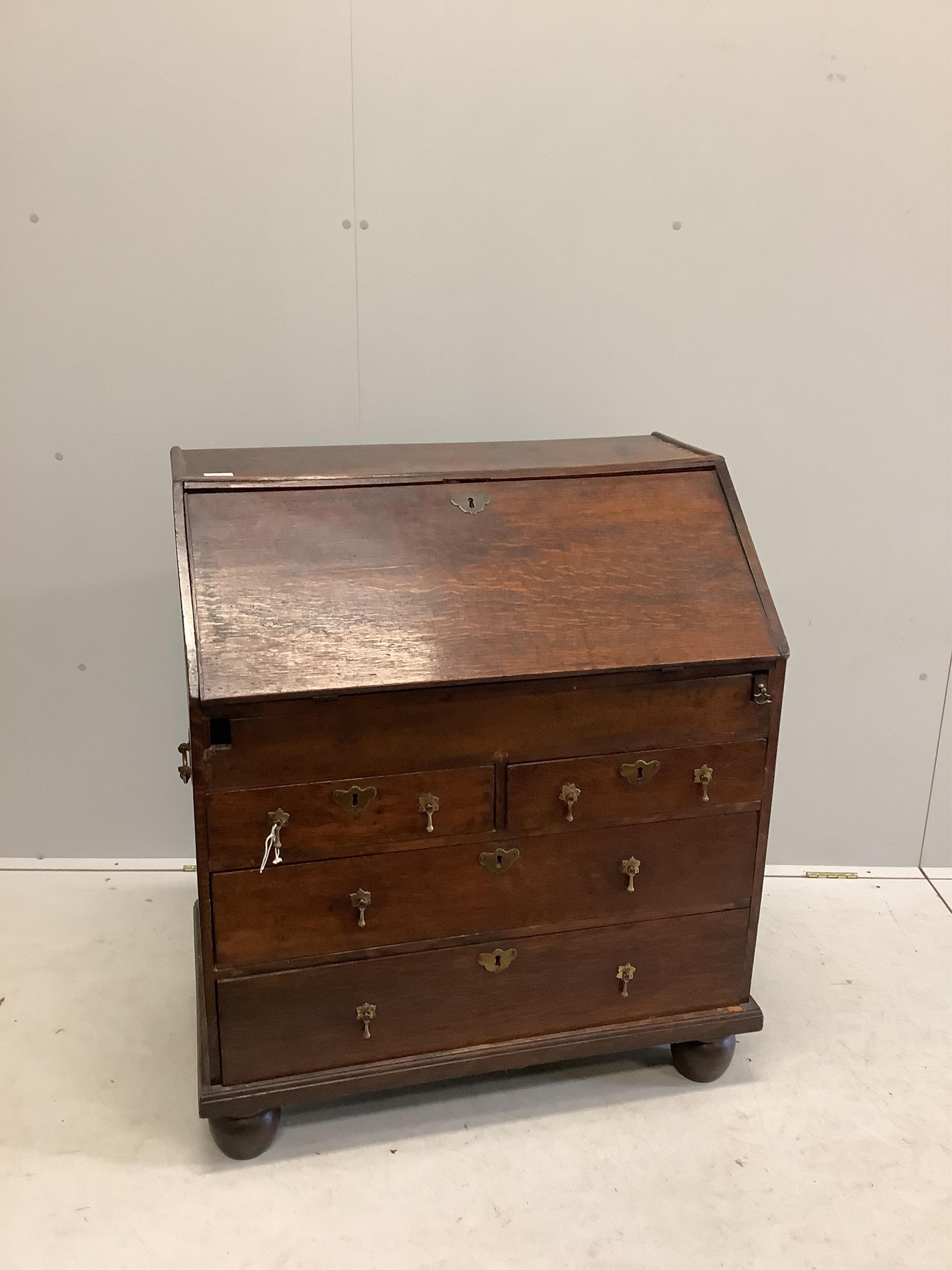 An 18th century oak bureau, width 84cm, depth 52cm, height 98cm. Condition - poor to fair